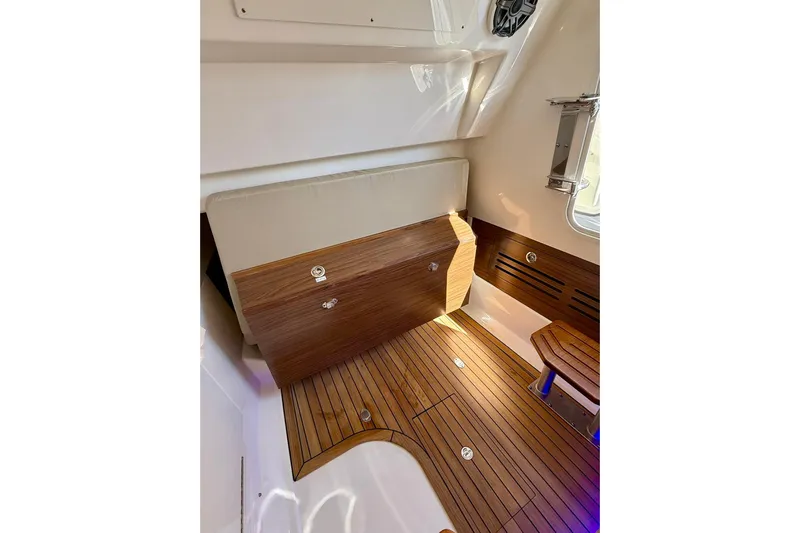 Ghost Rider Yacht Photos Pics 2024 Boston Whaler 360 Outrage interior with elegant wood flooring and seating.