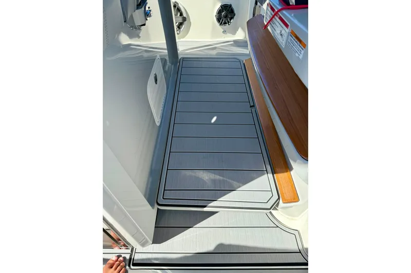 Ghost Rider Yacht Photos Pics 2024 Boston Whaler 360 Outrage deck with sleek flooring and modern design elements.
