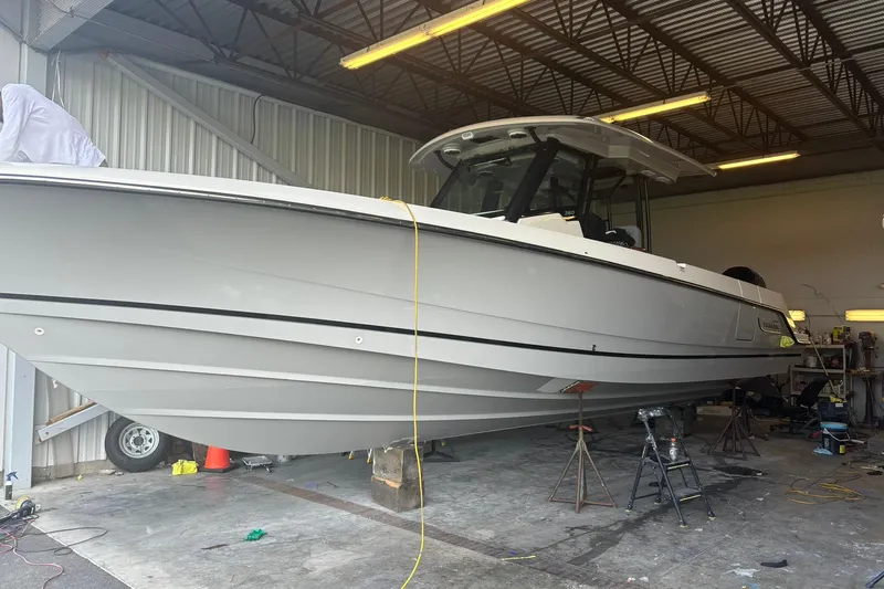 Ghost Rider Yacht Photos Pics 2024 Boston Whaler 360 Outrage boat in a workshop setting.