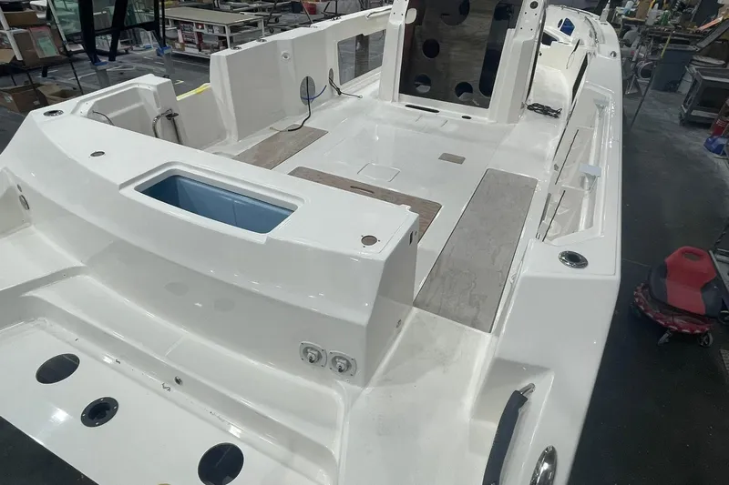Ghost Rider Yacht Photos Pics 2024 Boston Whaler 360 Outrage boat interior under construction in a workshop.
