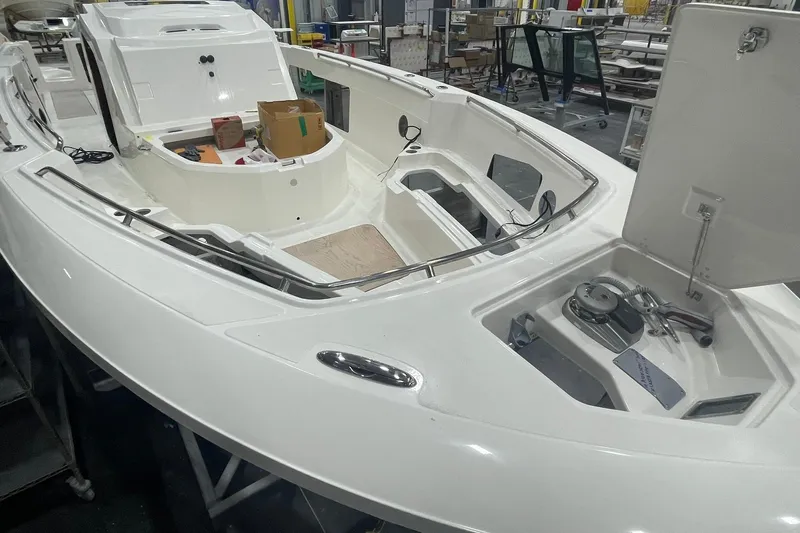 Ghost Rider Yacht Photos Pics 2024 Boston Whaler 360 Outrage boat interior under construction in a workshop.