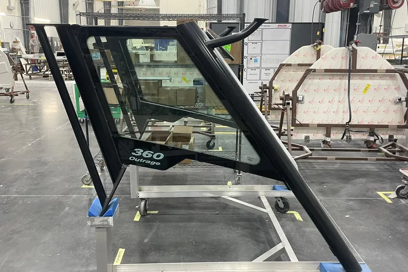 Ghost Rider Yacht Photos Pics 2024 Boston Whaler 360 Outrage windshield in a manufacturing facility.
