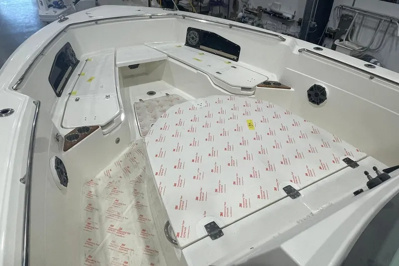 Ghost Rider Yacht Photos Pics 2024 Boston Whaler 360 Outrage boat interior with seating and storage compartments.