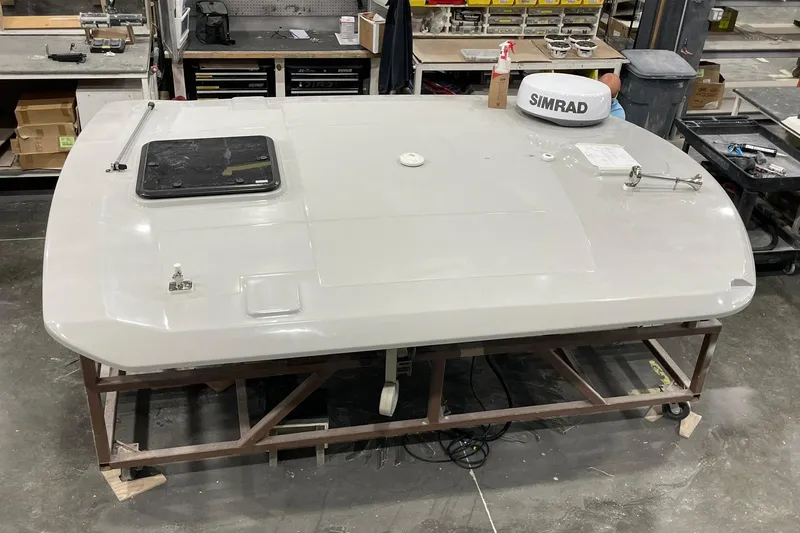 Ghost Rider Yacht Photos Pics 2024 Boston Whaler 360 Outrage boat component in workshop setting.