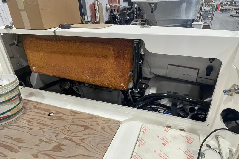 Ghost Rider Yacht Photos Pics 2024 Boston Whaler 360 Outrage engine compartment with visible components and wiring.