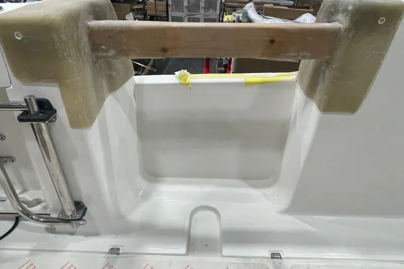 Ghost Rider Yacht Photos Pics 2024 Boston Whaler 360 Outrage boat interior detail with ladder and unfinished components.