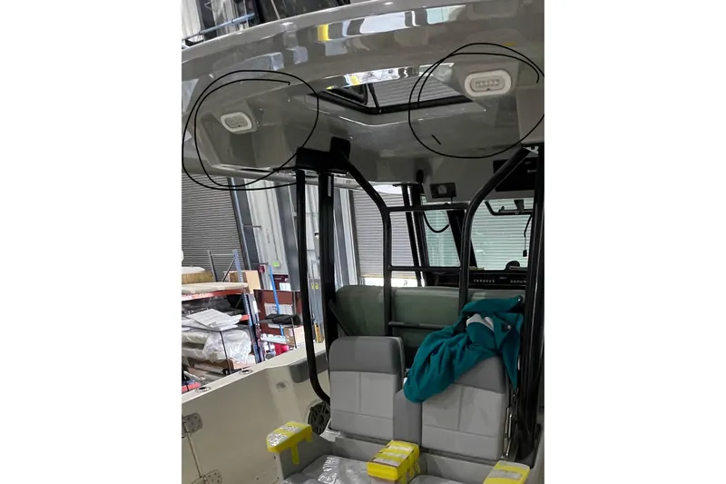 Ghost Rider Yacht Photos Pics 2024 Boston Whaler 360 Outrage interior with seating and overhead lighting.