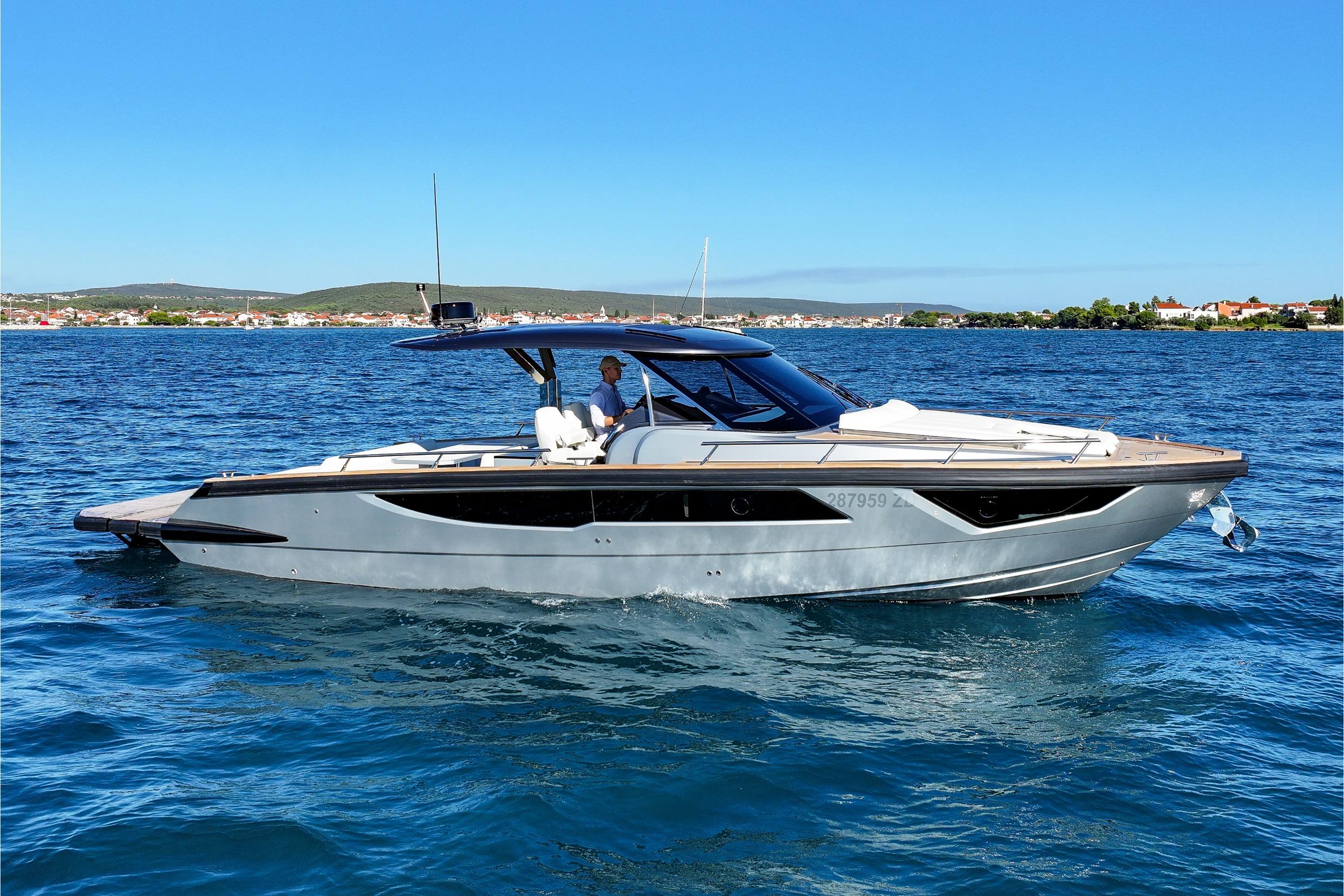 2024 Focus Forza 37 luxury yacht cruising on a sunny day in clear blue waters.