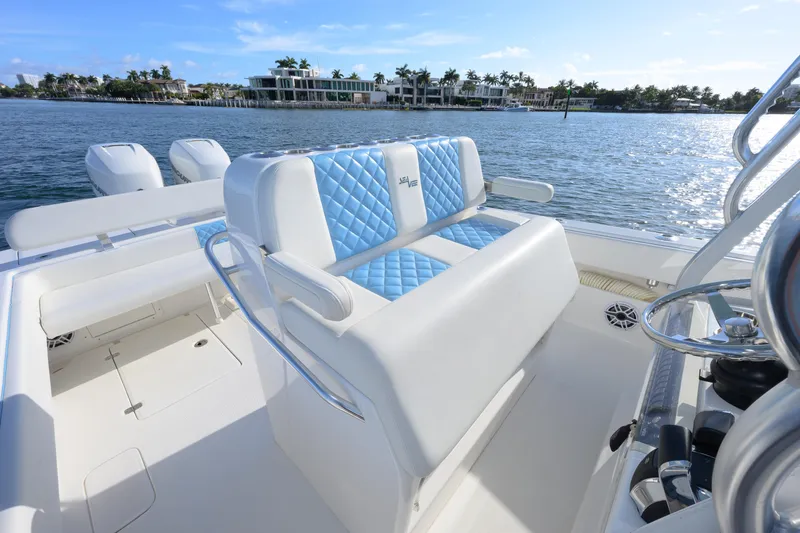  Yacht Photos Pics 2022 SeaVee 340Z boat interior with blue and white seating, ocean view.