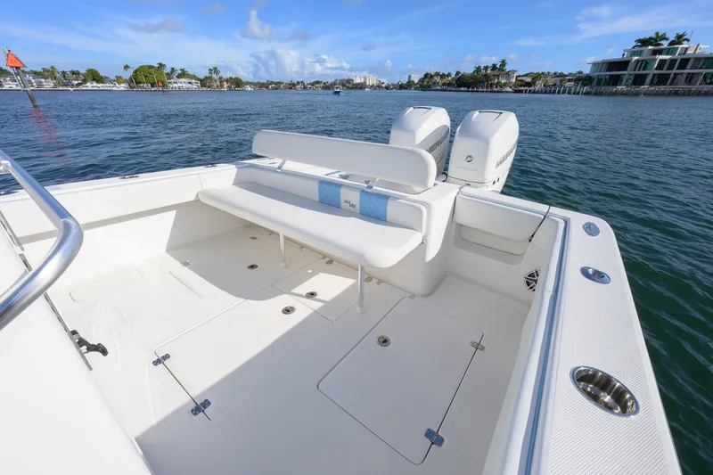  Yacht Photos Pics 2022 SeaVee 340Z boat with spacious deck and twin engines on calm water.