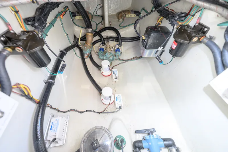  Yacht Photos Pics Engine compartment of 2022 SeaVee 340Z boat, showcasing wiring and mechanical components.