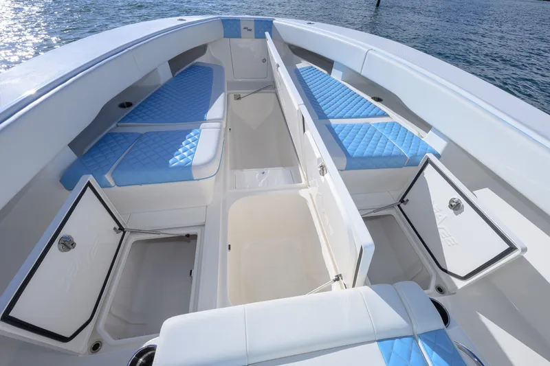  Yacht Photos Pics 2022 SeaVee 340Z boat interior with blue cushioned seating and open storage compartments.