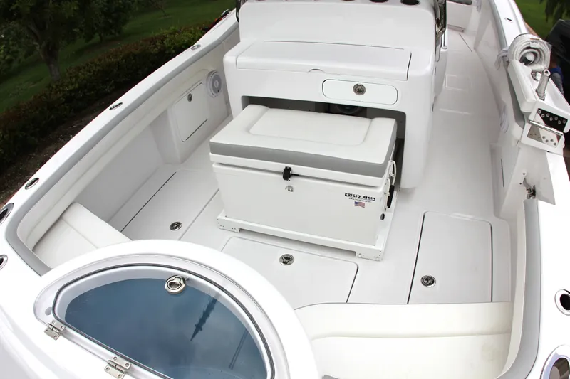  Yacht Photos Pics 2025 Mag Bay 33 boat interior with seating and storage compartments.
