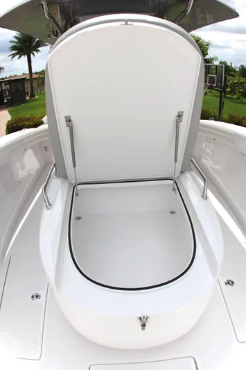  Yacht Photos Pics 2025 Mag Bay 33 boat with open storage compartment.