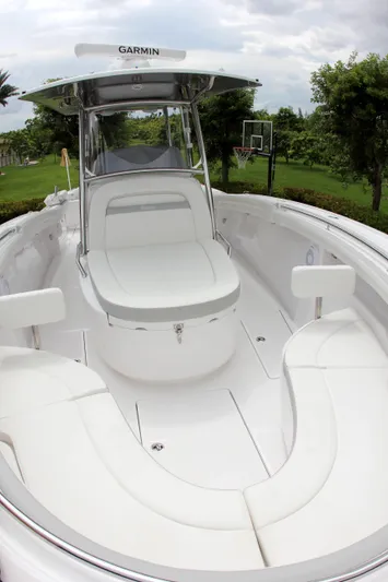  Yacht Photos Pics 2025 Mag Bay 33 boat with white seating and Garmin navigation system.