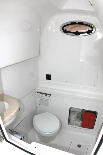  Yacht Photos Pics 2025 Mag Bay 33 boat interior bathroom with toilet and sink.