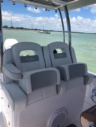  Yacht Photos Pics Luxury seating on 2025 Mag Bay 33 boat with ocean view.