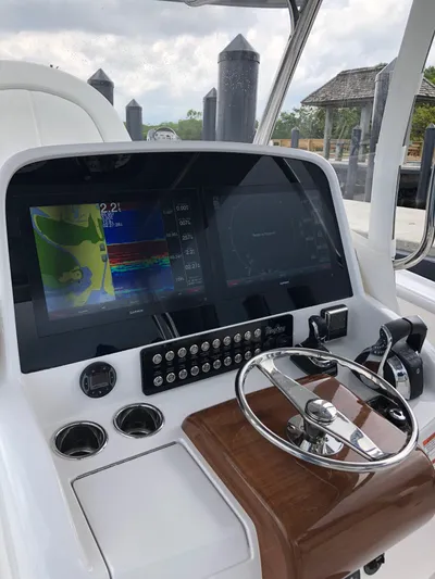  Yacht Photos Pics Helm station of 2025 Mag Bay 33 boat with advanced navigation system.