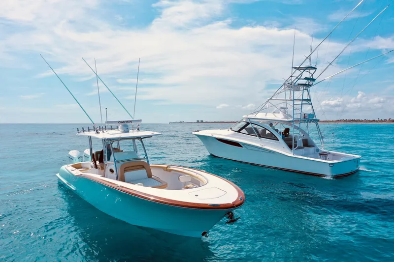  Yacht Photos Pics Two Mag Bay 33 boats on clear blue water, 2025 model.