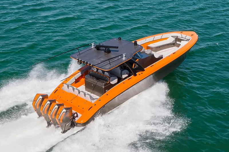 Va Va Vroom Yacht Photos Pics 2020 Midnight Express 43' Open boat with orange accents cruising on the ocean.