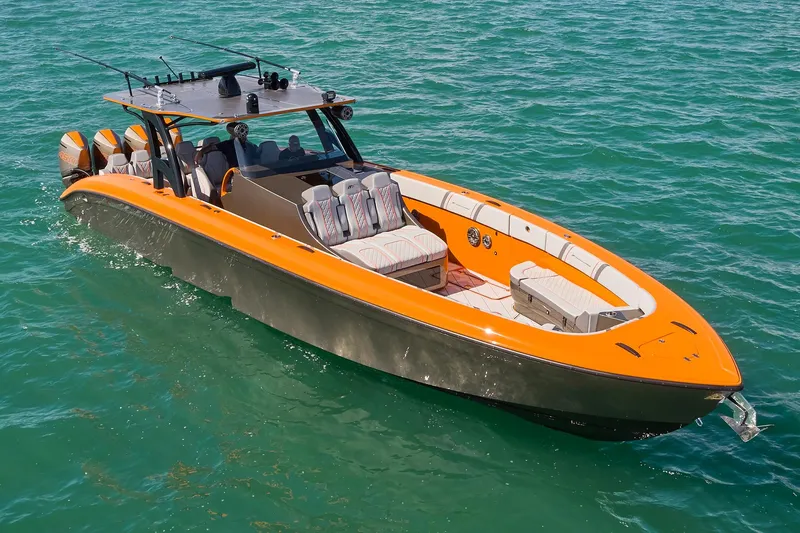 Va Va Vroom Yacht Photos Pics 2020 Midnight Express 43' Open boat with orange accents on clear blue water.