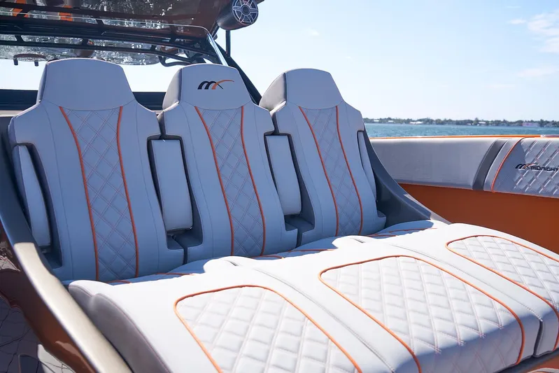 Va Va Vroom Yacht Photos Pics Luxurious seating on 2020 Midnight Express 43' Open boat with quilted design and orange accents.