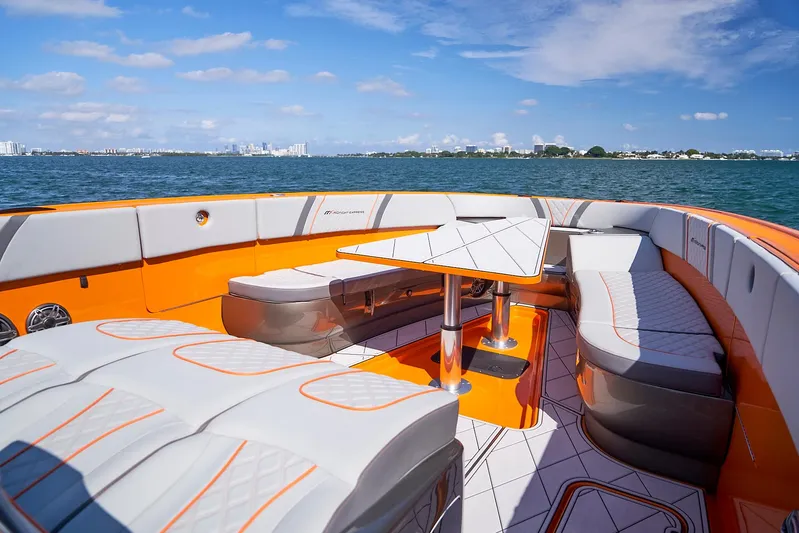 Va Va Vroom Yacht Photos Pics Luxurious 2020 Midnight Express 43' Open boat with stylish orange and white seating on open water.