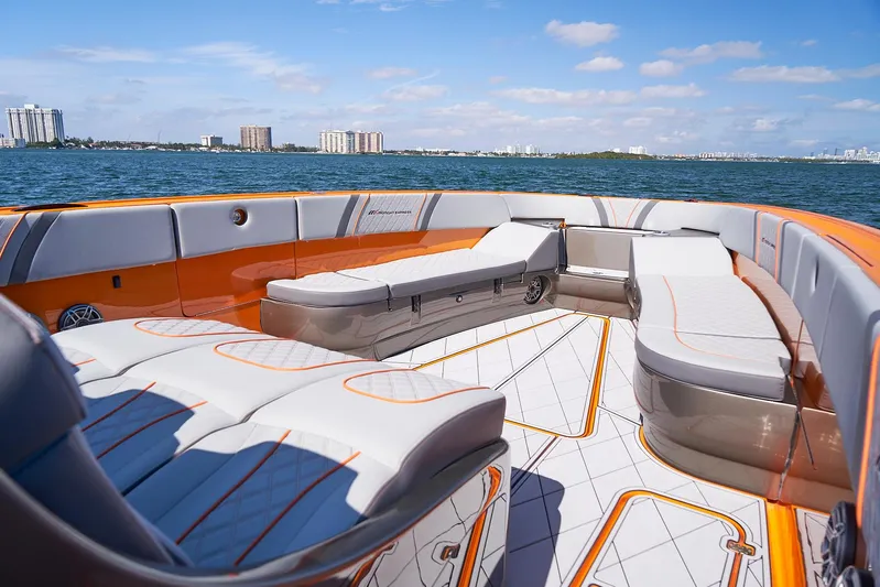Va Va Vroom Yacht Photos Pics Luxurious 2020 Midnight Express 43' Open boat interior with orange and white seating on the water.