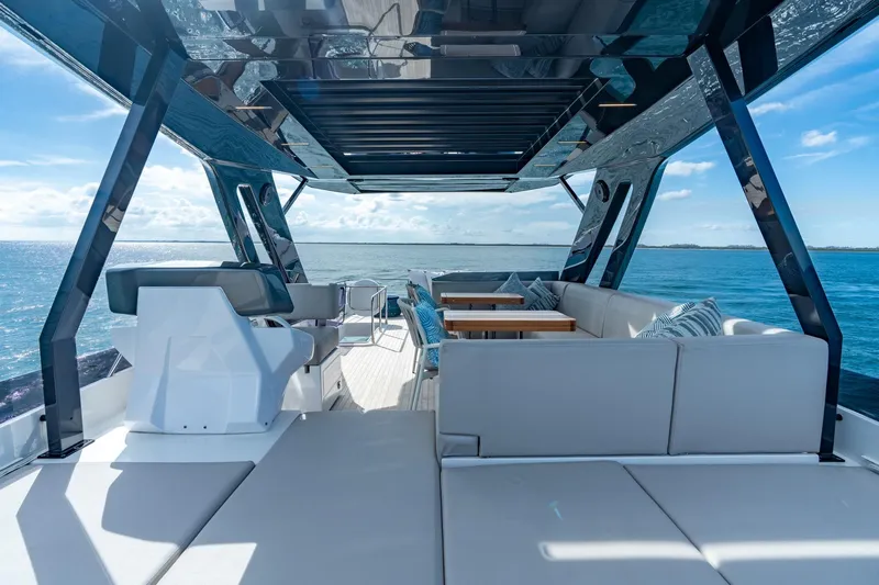  Yacht Photos Pics Luxurious 2023 Ferretti Yachts 720 deck with modern seating and ocean view.