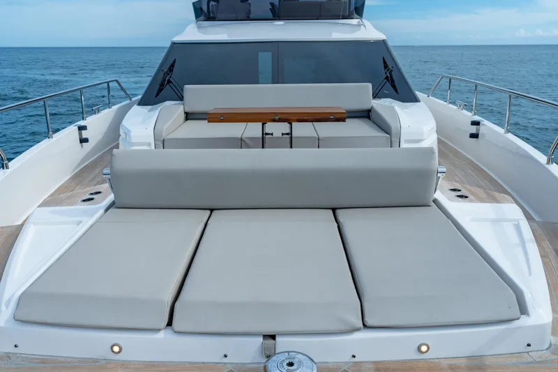  Yacht Photos Pics 2023 Ferretti Yachts 720 luxury deck with sun loungers and ocean view.