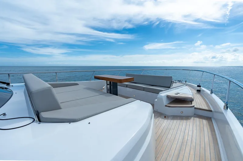  Yacht Photos Pics Luxurious 2023 Ferretti Yachts 720 deck with elegant seating and ocean view.