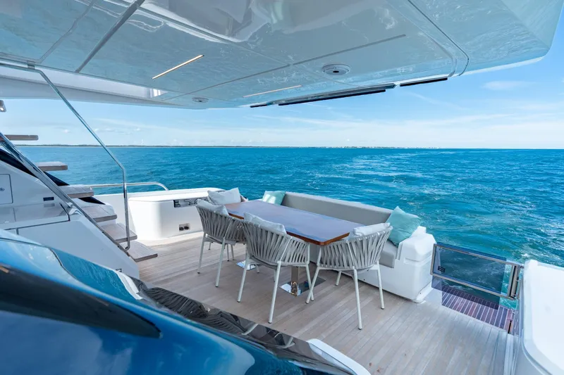  Yacht Photos Pics Luxurious 2023 Ferretti Yachts 720 deck with ocean view and elegant seating area.