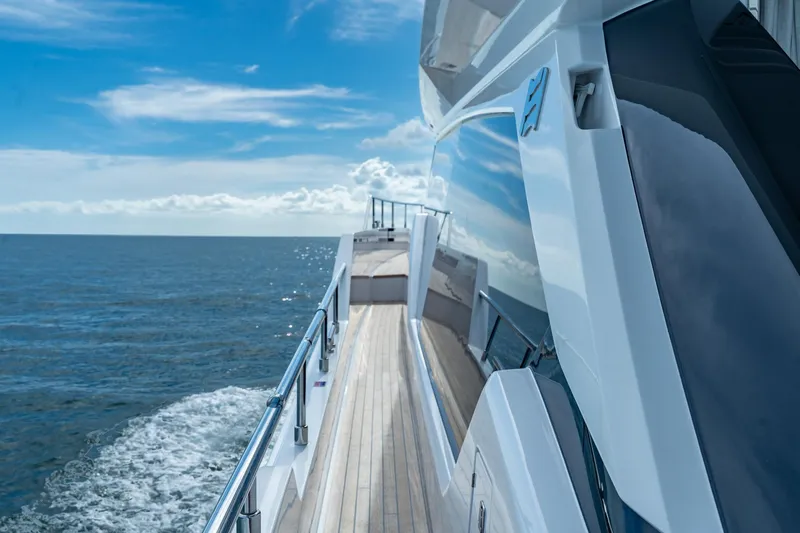  Yacht Photos Pics 2023 Ferretti Yachts 720 cruising on open sea under clear blue sky.