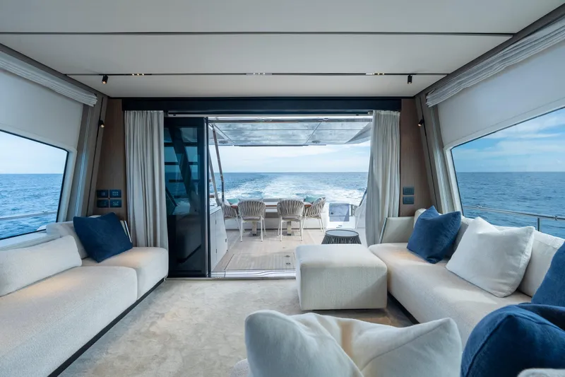  Yacht Photos Pics Luxurious interior of 2023 Ferretti Yachts 720 with ocean view and elegant seating.