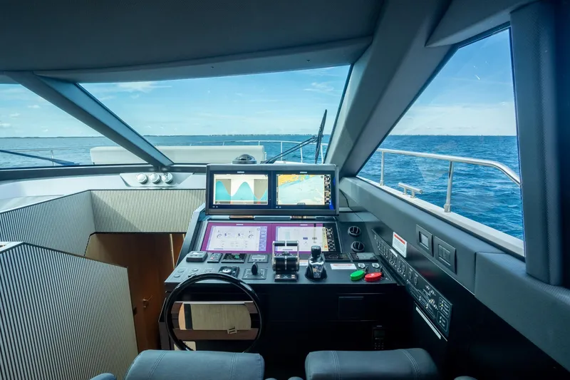  Yacht Photos Pics Cockpit of 2023 Ferretti Yachts 720 with advanced navigation systems and ocean view.
