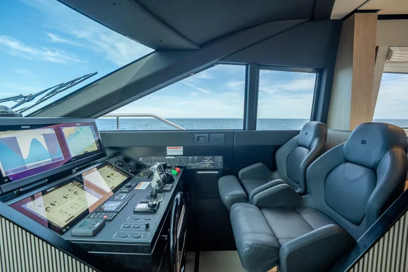  Yacht Photos Pics Luxurious helm of 2023 Ferretti Yachts 720 with advanced navigation systems and ocean view.