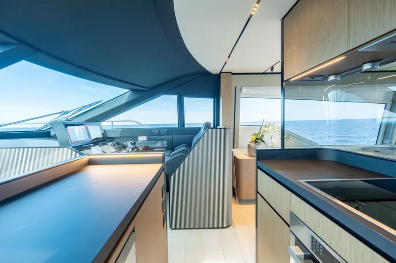  Yacht Photos Pics Luxurious interior of 2023 Ferretti Yachts 720 with modern kitchen and ocean view.
