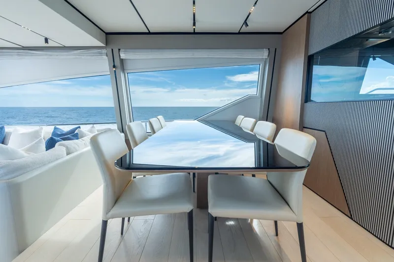  Yacht Photos Pics Luxurious interior of 2023 Ferretti Yachts 720 with ocean view and elegant dining area.