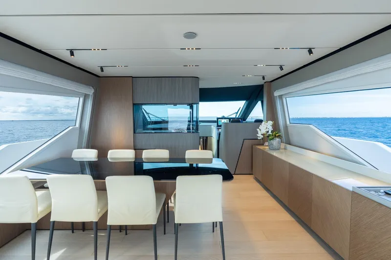  Yacht Photos Pics Luxurious interior of 2023 Ferretti Yachts 720 with elegant dining area and ocean view.