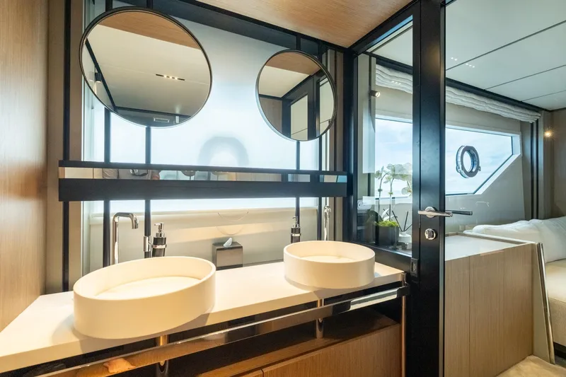  Yacht Photos Pics Luxurious bathroom interior of 2023 Ferretti Yachts 720 with dual sinks and modern design.