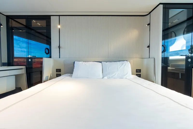  Yacht Photos Pics Luxurious bedroom interior of 2023 Ferretti Yachts 720 with modern design and ocean view.