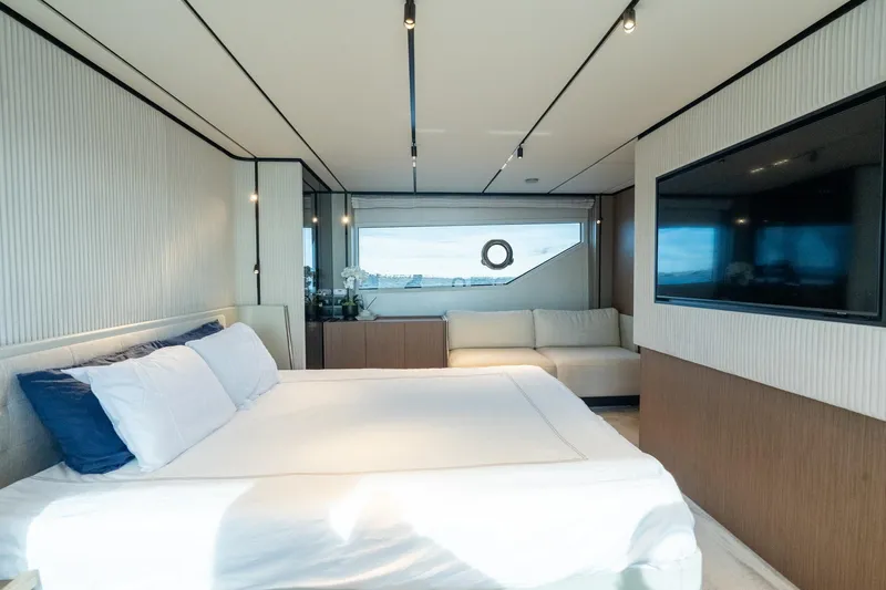  Yacht Photos Pics Luxurious bedroom interior of 2023 Ferretti Yachts 720 with modern design and large window view.