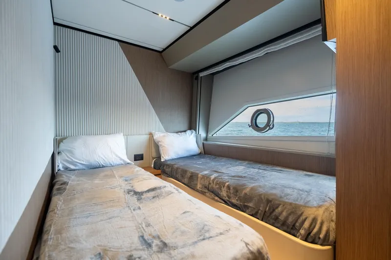  Yacht Photos Pics Luxurious twin bedroom in 2023 Ferretti Yachts 720 with ocean view.