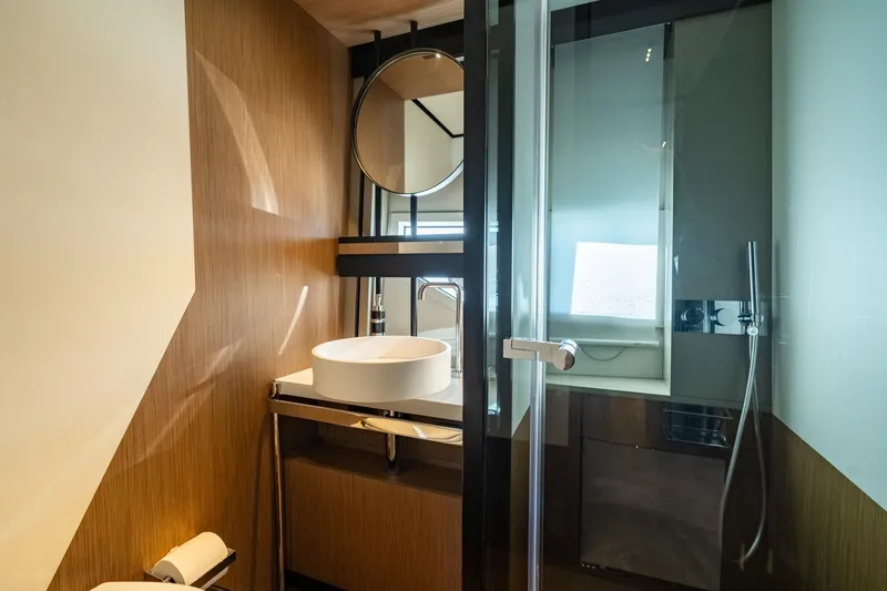  Yacht Photos Pics Luxurious bathroom in 2023 Ferretti Yachts 720, featuring modern design and elegant fixtures.