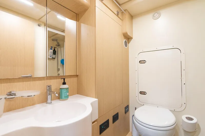  Yacht Photos Pics Luxurious bathroom in 2023 Ferretti Yachts 720, featuring modern fixtures and elegant design.