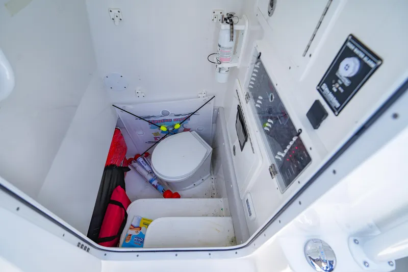  Yacht Photos Pics 2023 SeaHunter 31 Tournament boat interior with storage and control panel.