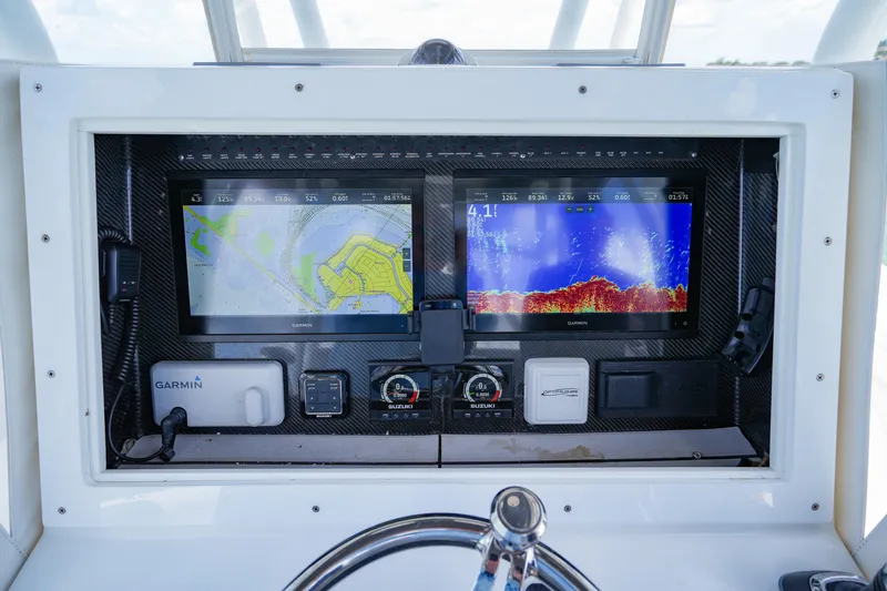  Yacht Photos Pics 2023 SeaHunter 31 Tournament dashboard with Garmin navigation and sonar displays.