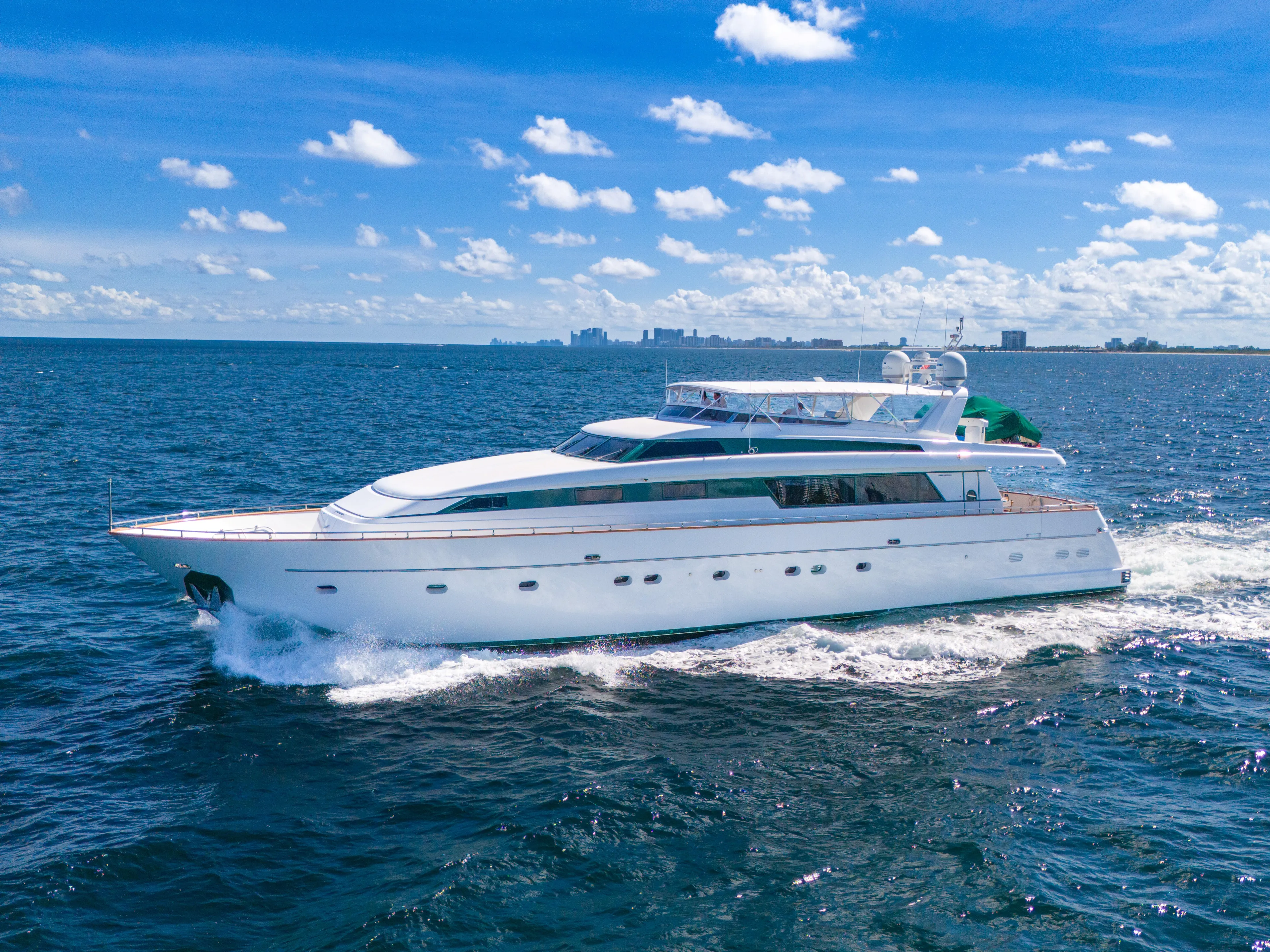  Yacht Photos Pics Sanlorenzo 100SL 1998 yacht cruising on open sea under clear blue sky.