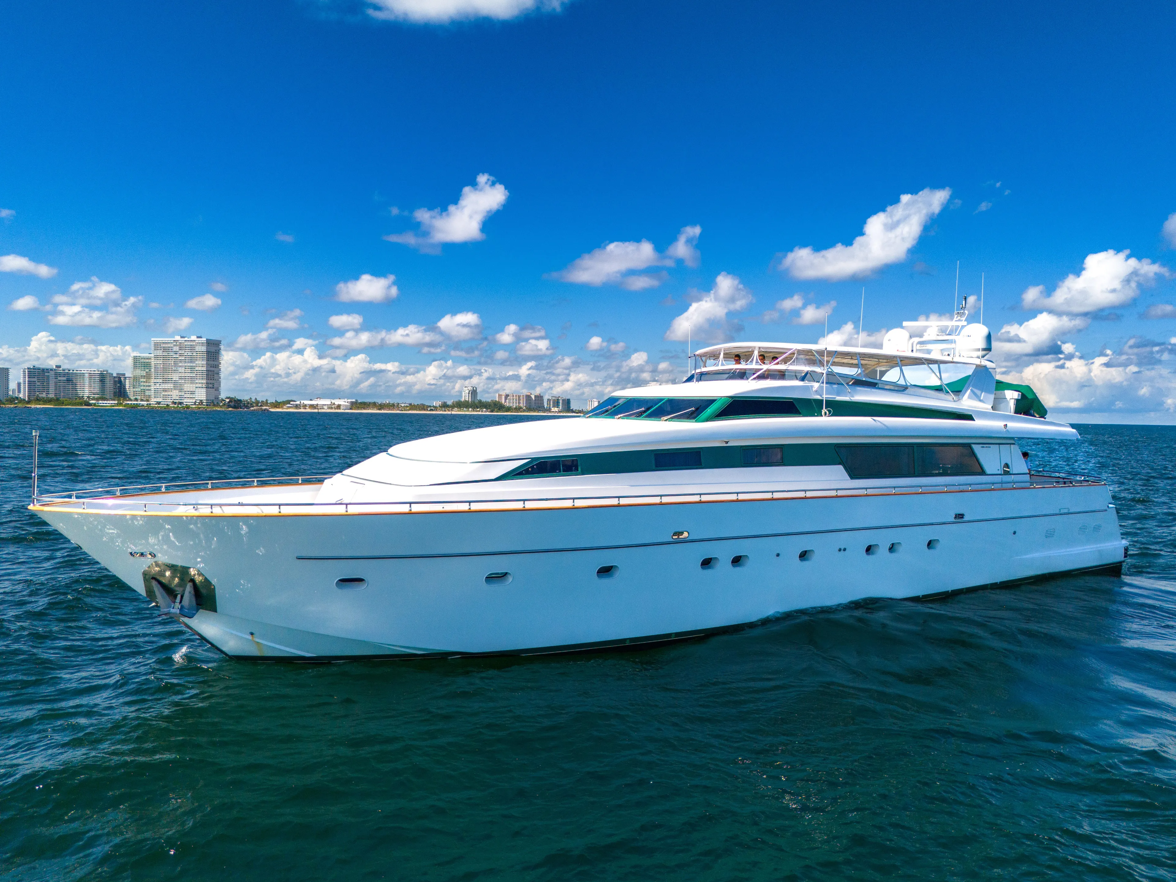  Yacht Photos Pics Sanlorenzo 100SL 1998 yacht cruising on a sunny day with blue skies.