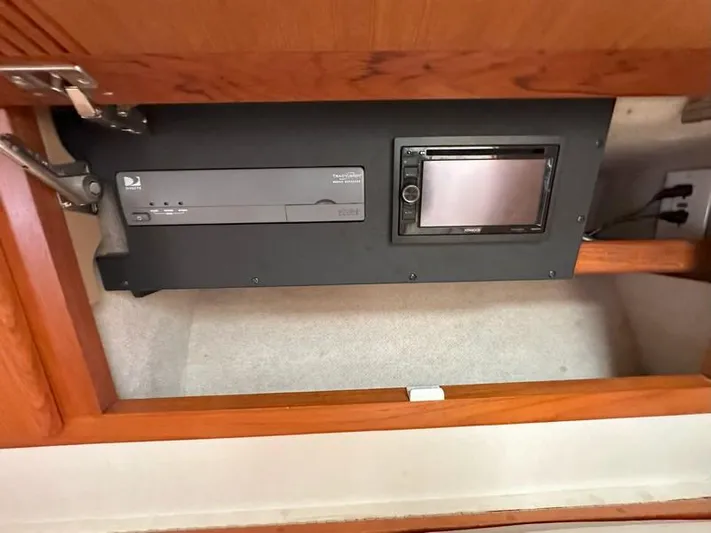 Tuna Daze Yacht Photos Pics 2004 Cabo Express interior electronics panel with TV receiver and control screen.